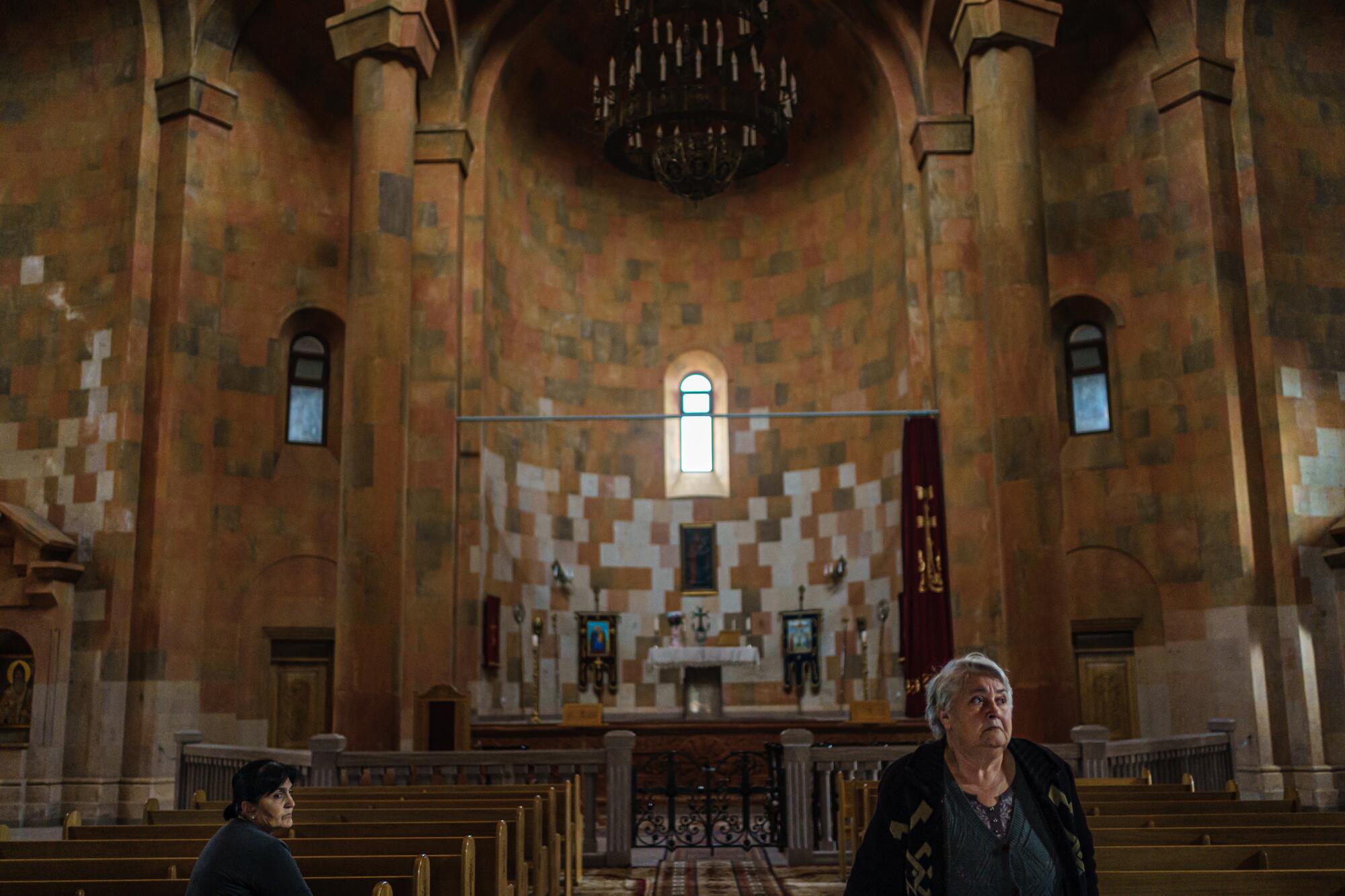 Local residents pray at the Holy Mother of God Cathedral.