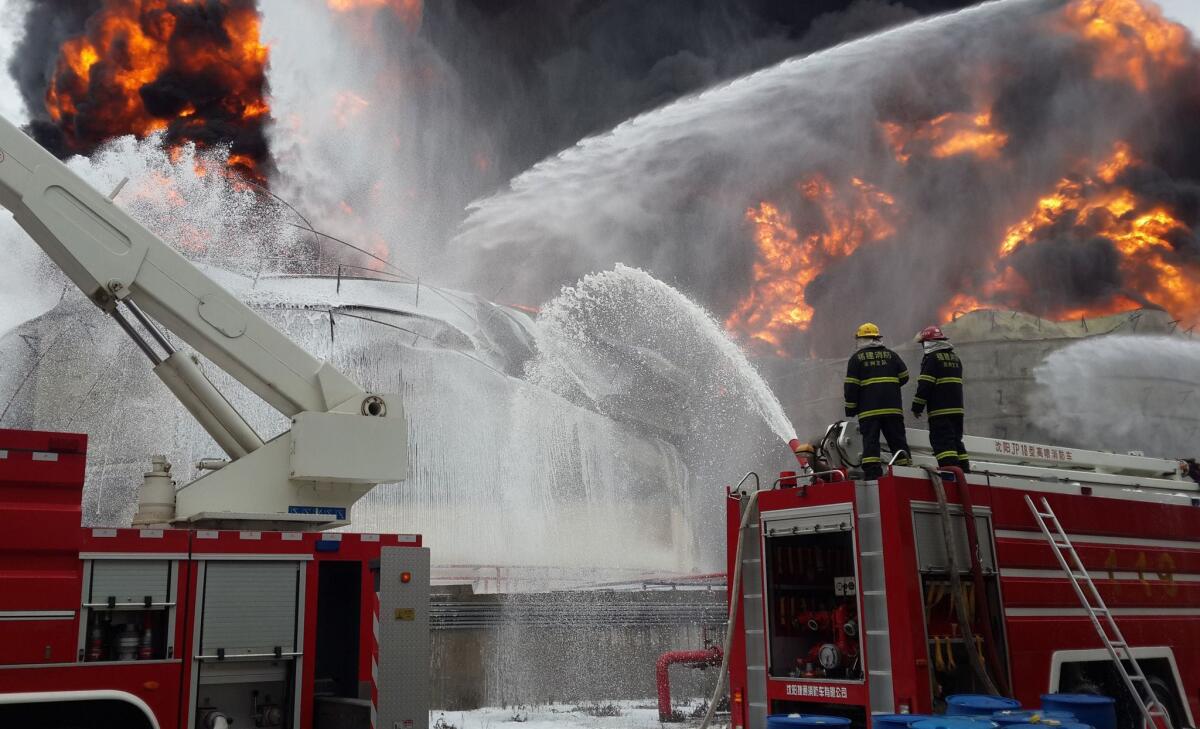Firefighters battle a blaze following an explosion at a plant producing paraxylene - a chemical commonly known as PX - in Zhengzhou, in east China's Fujian province, on April 8.