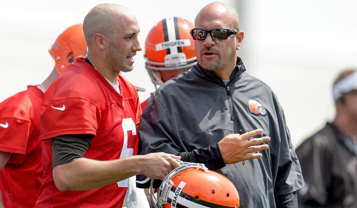 Browns quarterback Brian Hoyer talks to Coach Mike Pettine during training camp earlier this summer.