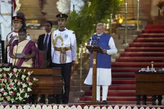Narendra Modi, right, is sworn-in as the Prime Minister of India by President Draupadi Murmu, left, at the Rashtrapati Bhawan, in New Delhi, India, Sunday, June 9, 2024. The 73-year-old leader is only the second Indian prime minister to retain power for a third term. (AP Photo/Manish Swarup)