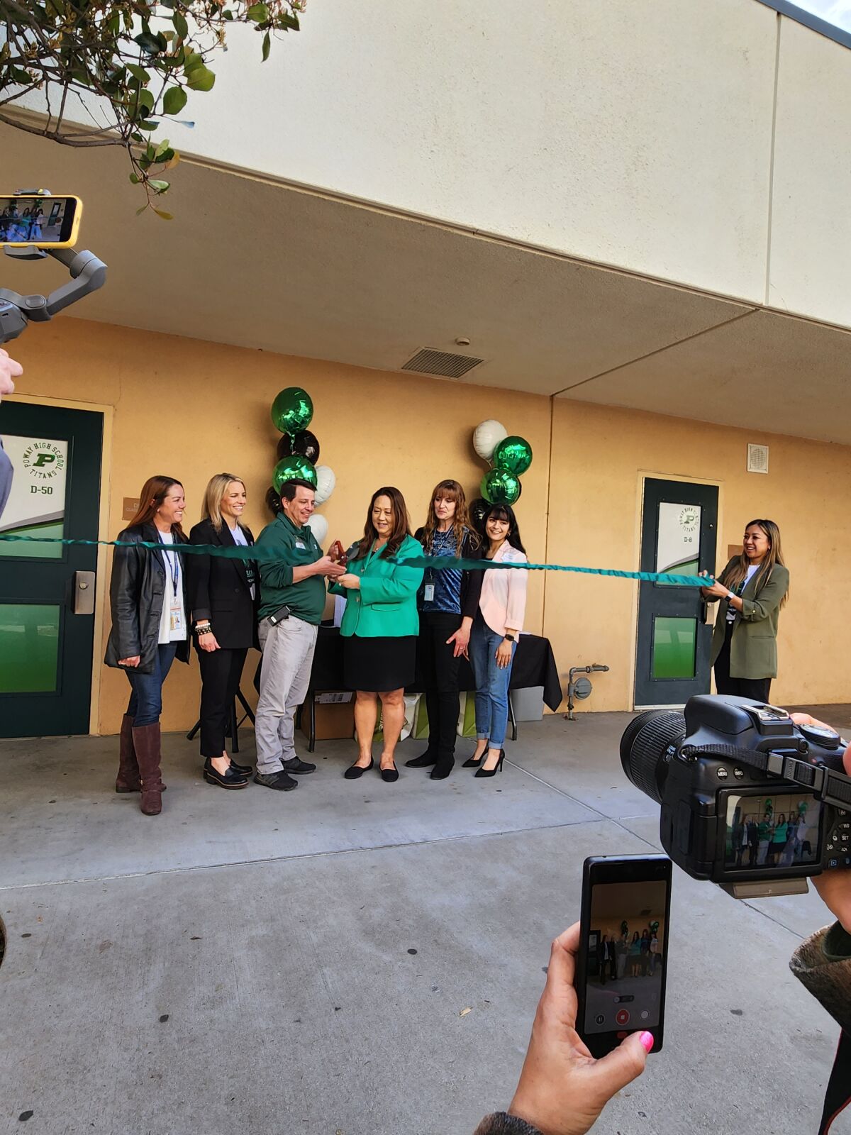 Poway Principal Richard Nash and Poway Unified School District trustees cutting the ribbon for the Esports Arena.