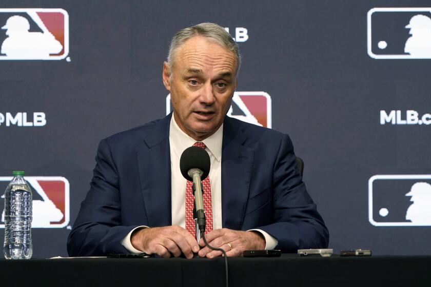 FILE - Major League Baseball commissioner Rob Manfred speaks during a news conference in Arlington, Texas.
