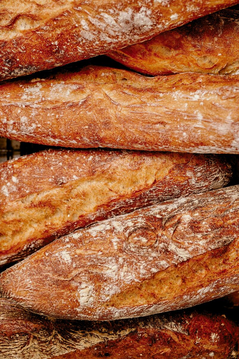A stack of baguettes seen in closeup