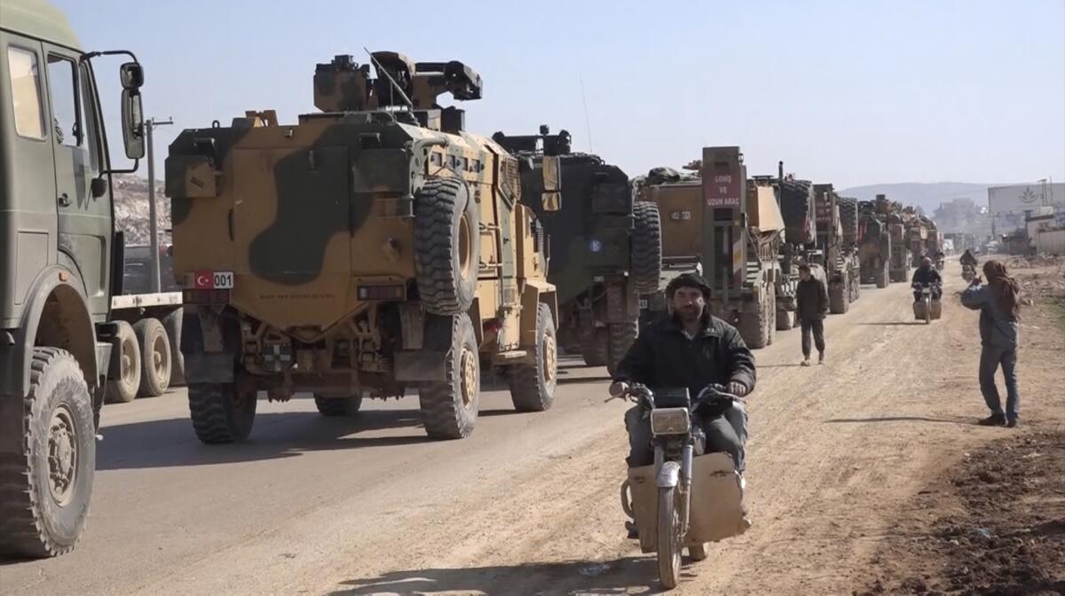An image taken from video shows a Turkish military convoy in the northwestern province of Idlib, Syria, on Sunday.