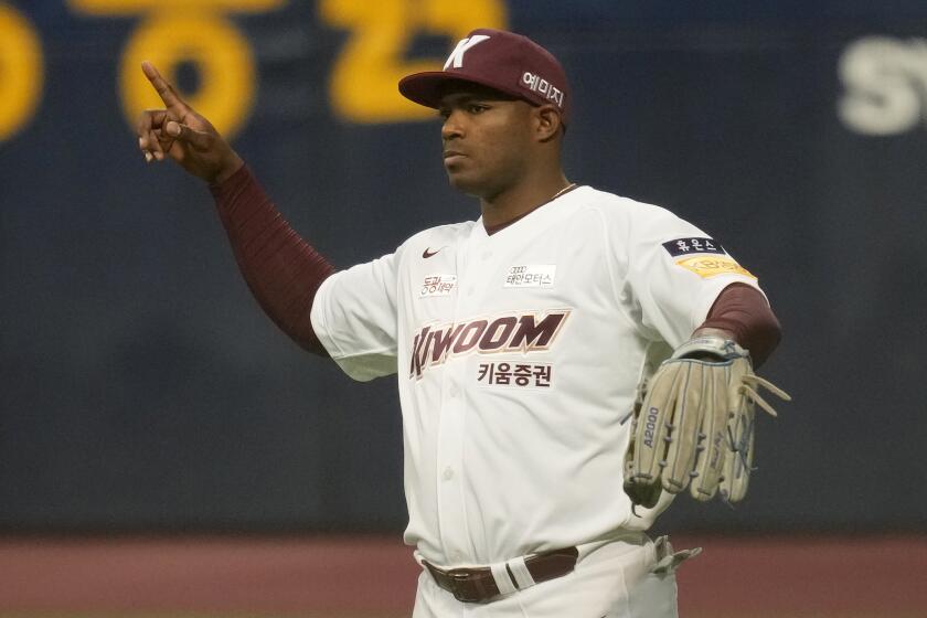 Former Major League Baseball outfielder Yasiel Puig of Kiwoom Heroes gestures  in the outfield