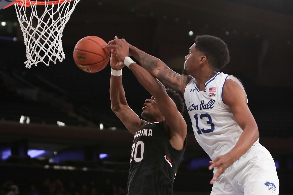 Seton Hall's Myles Powell (13) blocks a shot by South Carolina's Chris Silva (30) in the second half of the Under Armour Reunion at Madison Square Garden on Dec. 12.