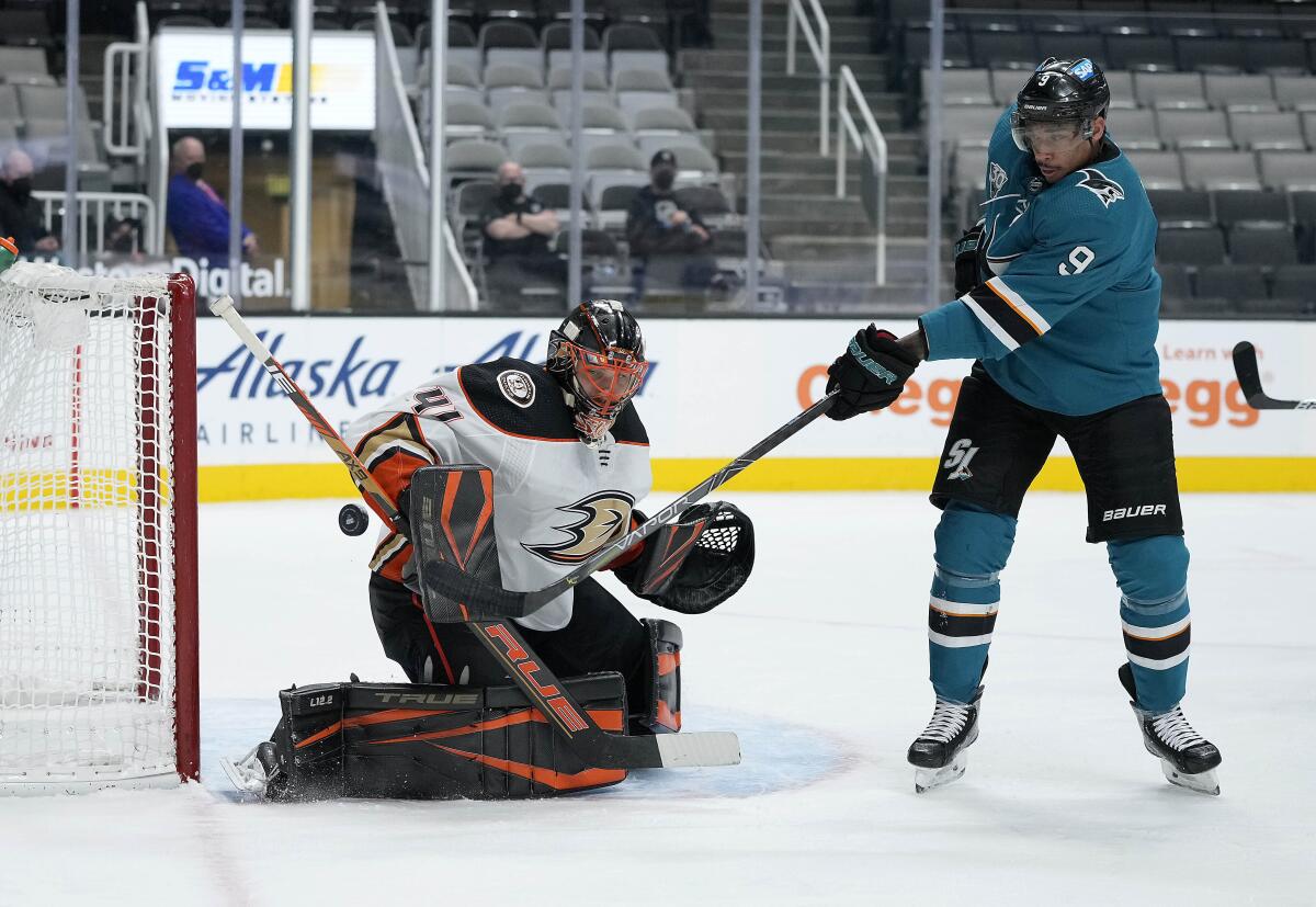 Anaheim Ducks goaltender Anthony Stolarz blocks a shot by San Jose Sharks left wing Evander Kane.