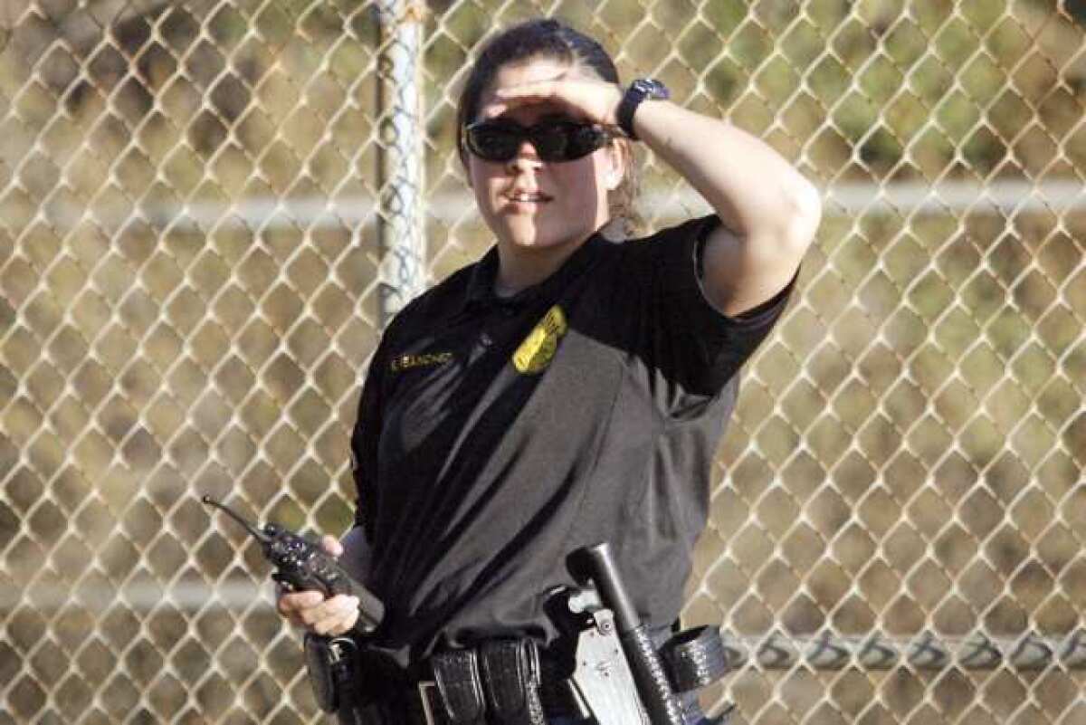 Officer Kristiana Sanchez practices a pursuit during a police training at the Starlight Bowl in Burbank. Less than 10% of the department's officers are women.