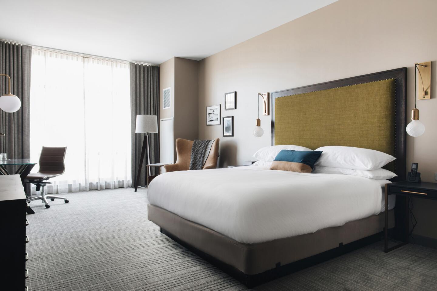 A Hotel Zachary mock guest room evokes neighborhood comfort and Chicago history, along with a few subtle nods to Wrigley Field, said Lisa Chervinsky, Stantec’s lead designer for the 173 guest rooms.