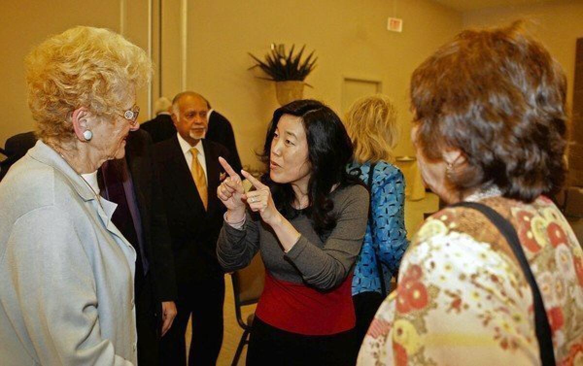 Michelle Rhee, center, former Chancellor, Washington DC Public Schools, answers questions after delivering a speech.