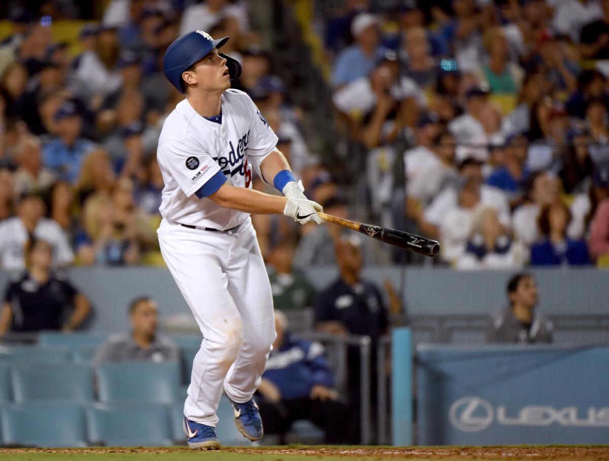 The Dodgers' Will Smith watches his grand slam against the Padres on Aug. 1, 2019.