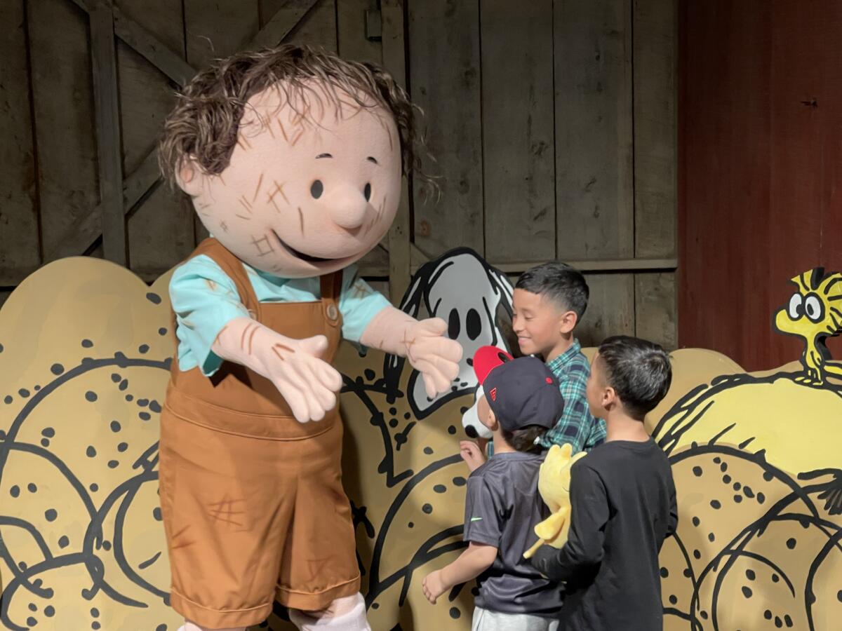 "Pig-Pen" greets kids at Knott’s Berry Farm’s annual Peanuts Celebration.