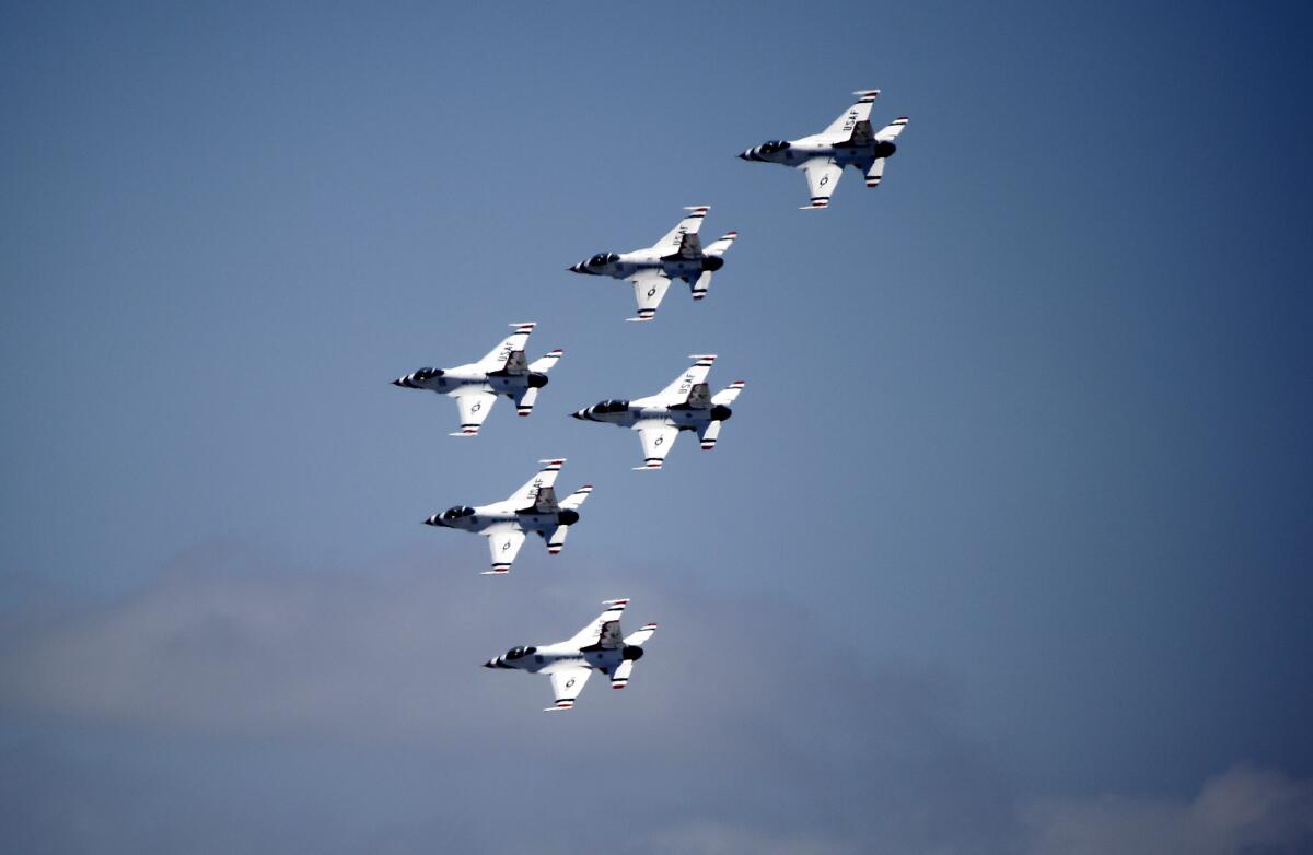 The Air Force Thunderbirds do a fly-by to salute the state’s COVID-19 first responders, some of whom watched from Hoag Memorial Hospital Presbyterian in Newport Beach on Friday.