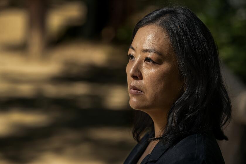 LOS ANGELES, CA-JUNE 10, 2022: Cathy Lee, 40, is photographed at Griffith Park in Los Angeles. Her father, Dal Keun Lee, 70, was fatally stabbed outside his laundromat in South Los Angeles for no apparent reason on May 5, 2022. (Mel Melcon / Los Angeles Times)