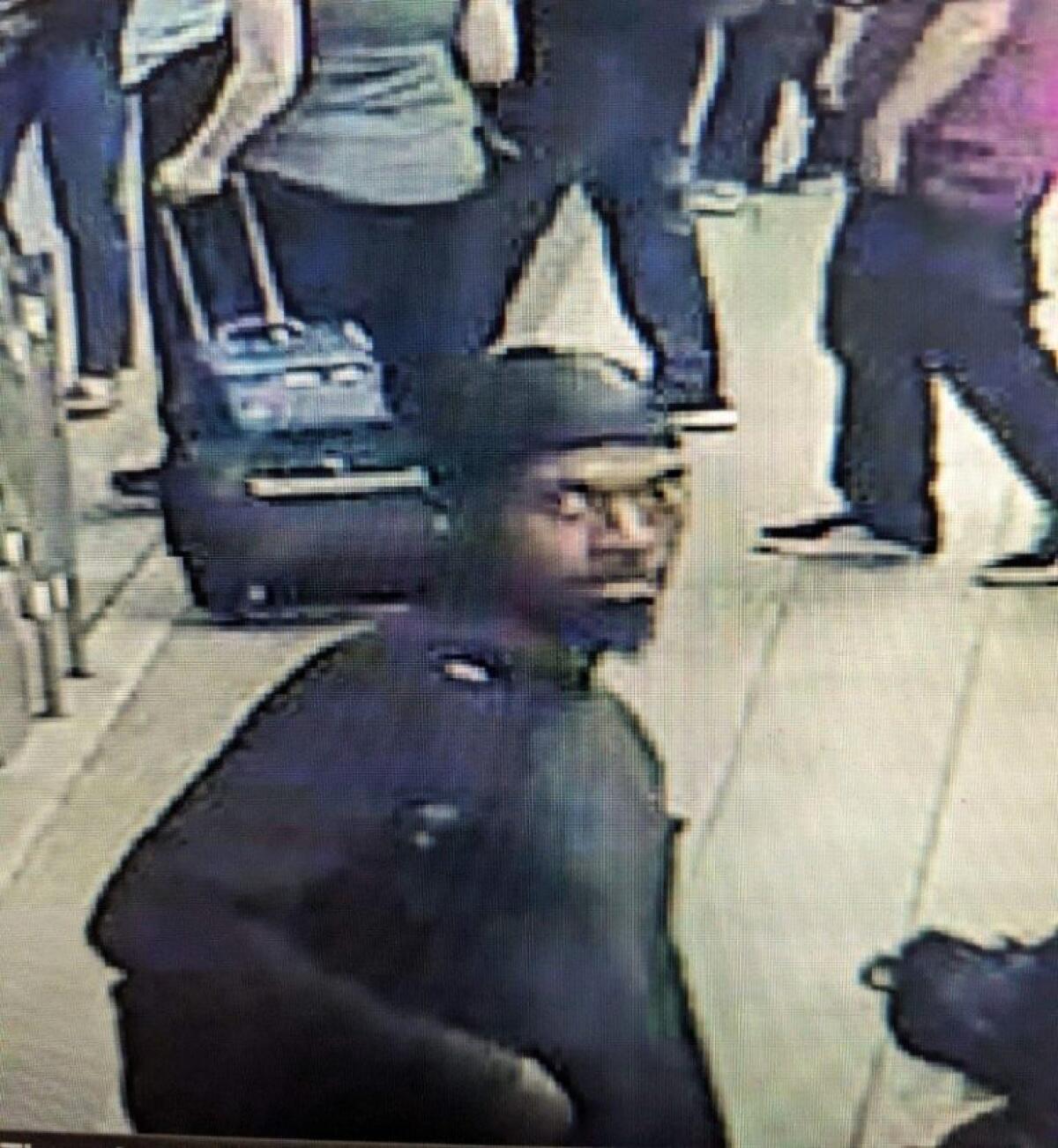 A man in a surveillance video still.