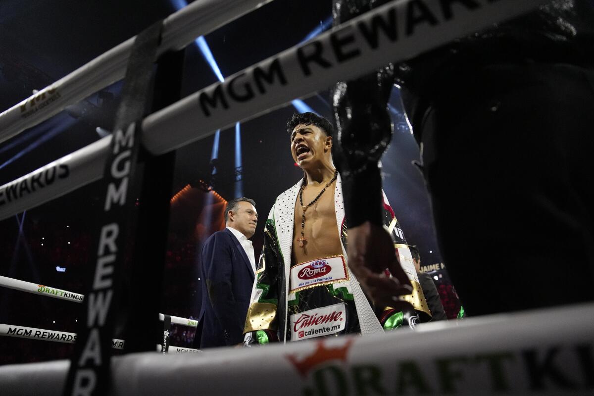 Jaime Munguia motions from the ring b