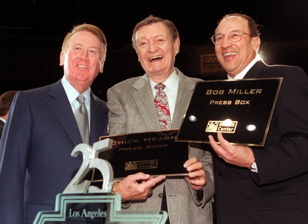 From left, Vin Scully, Chick Hearn and Bob Miller celebrating Miller's 25 years in broadcasting in 1998.