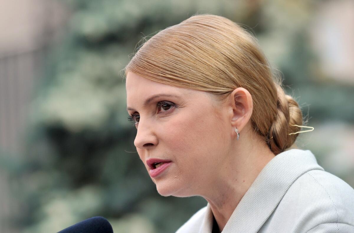 Former Ukrainian prime minister and opposition leader Yulia Tymoshenko speaks at a news conference in Kiev on Thursday. Ukraine's formerly jailed opposition icon completed an improbable return to politics following her release on Feb. 22, by confirming plans to run for president in elections on May 25.