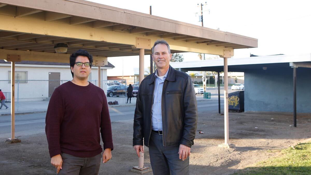 Robert Flores, senior scientist, left, and Jack Brouwer, associate director, both of UC Irvine’s Advanced Power and Energy Program, are leading a project to turn Oak View into an energy-efficient area as part of a nationwide challenge.