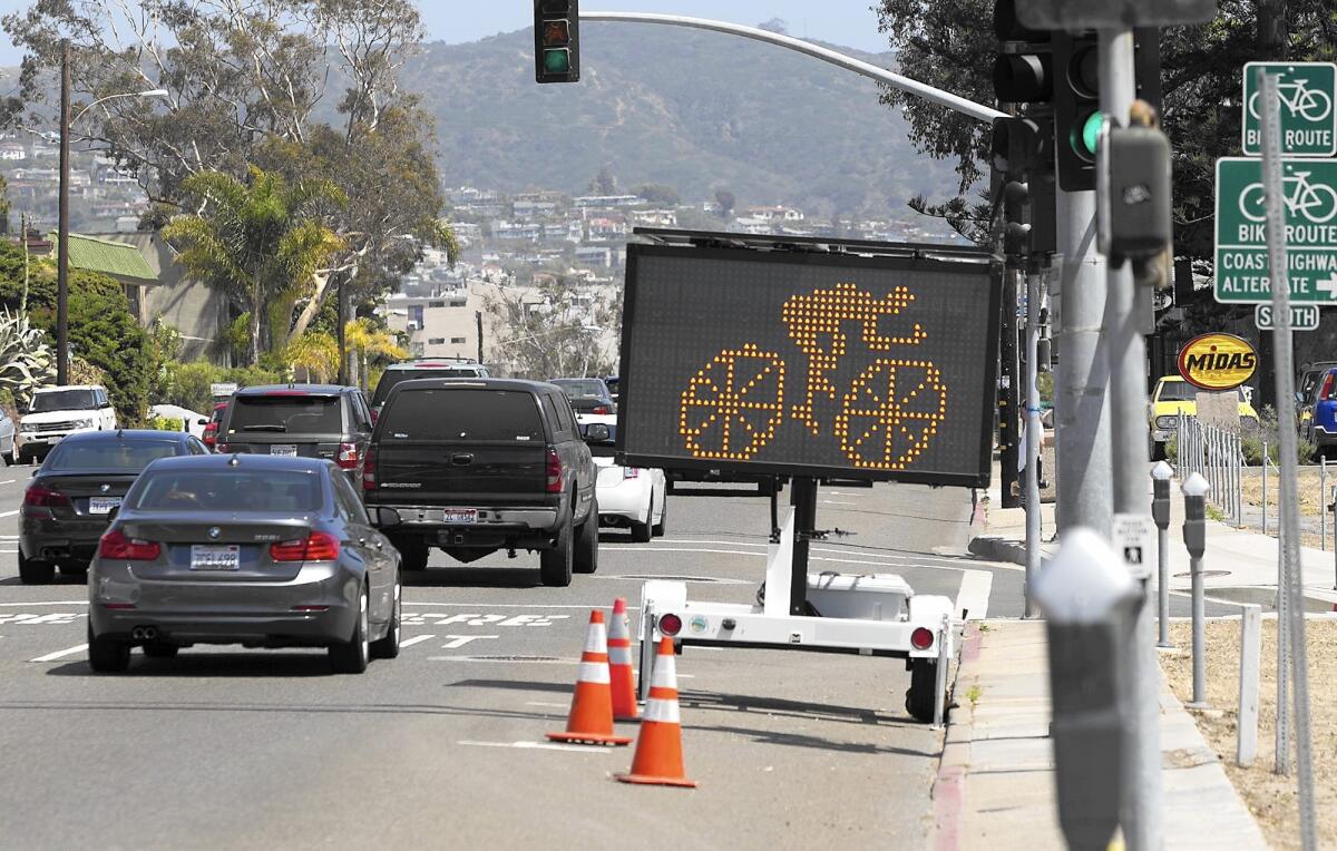 A traffic sign warns drivers to look out for bicyclists on Coast Highway in North Laguna. Conflicts between motorists and bicyclists are among problems cited in a study of Pacific Coast Highway between Seal Beach and San Clemente.