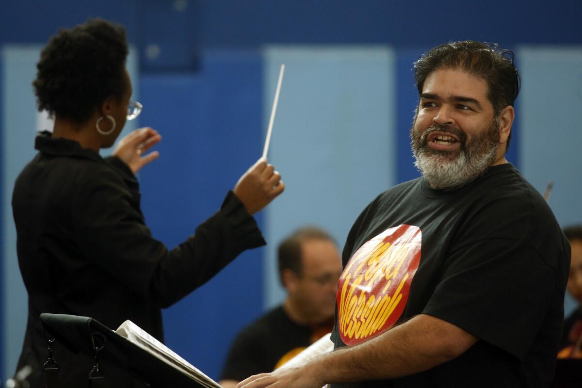Tenor and skid-row resident Don Garza with conductor Zanaida Robles in the the Street Symphony "Messiah Project" Friday afternoon at Midnight Mission.