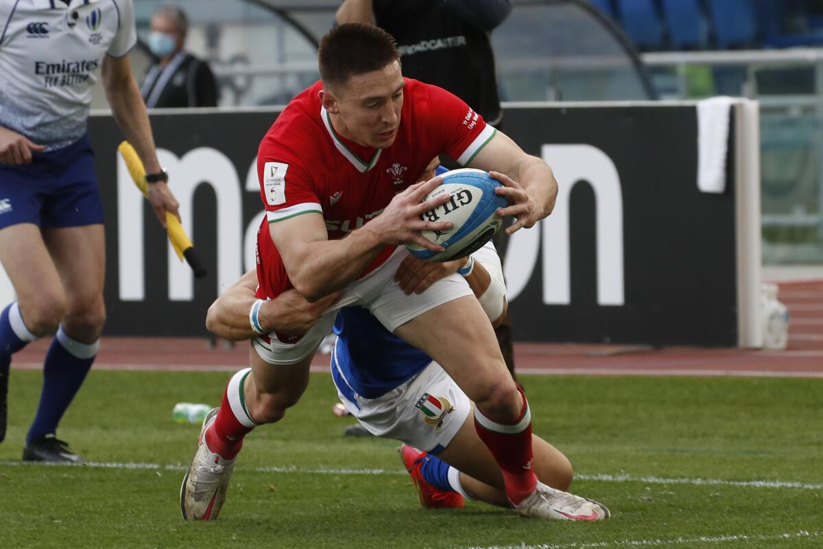 Wales'Josh Adams scores a try during the Six Nations rugby union match between Italy and Wales, in the Olympic stadium in Rome, Italy, Saturday, March 13, 2021. (AP Photo/Alessandra Tarantino)