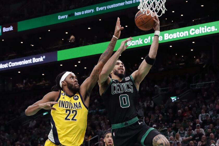 Boston Celtics' Jayson Tatum (0) shoots against Indiana Pacers' Isaiah Jackson (22) during the first half of an NBA basketball game Friday, March 24, 2023, in Boston. (AP Photo/Michael Dwyer)