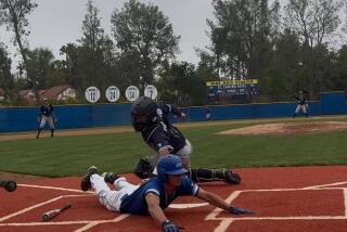 Shane Bogacz of El Camino Real gives a head-first slide to score the game's only run.
