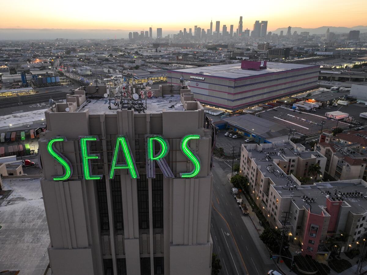 Sears building at forefront of a view of other buildings in the surrounding area.