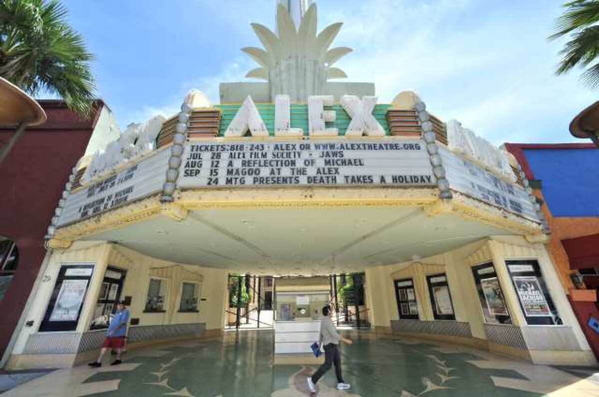 Pedestrians walk past the Alex Theatre on Tuesday, July 10, 2012. (Roger Wilson/Staff Photographer)