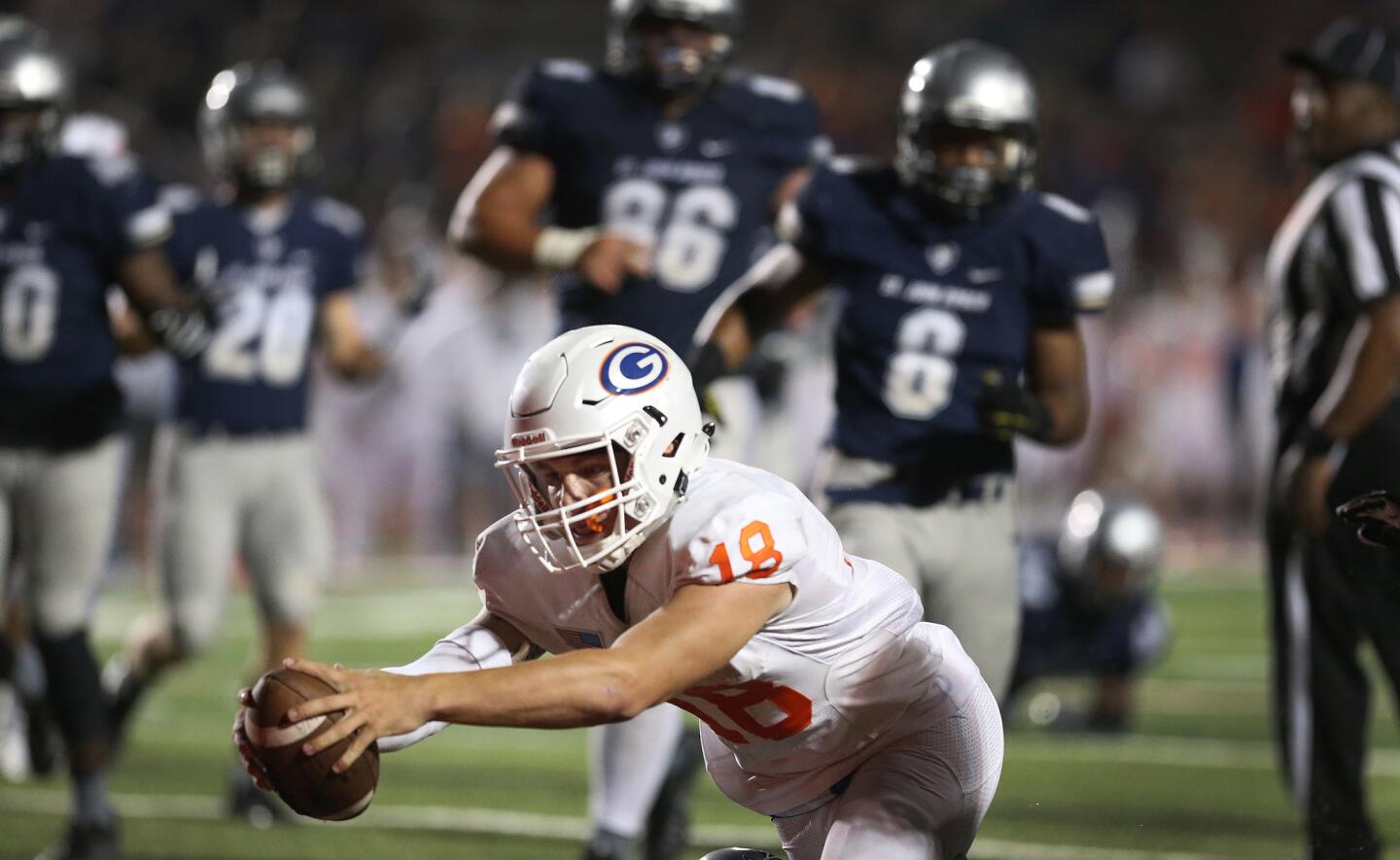 St. John Bosco's defense can only watch as Bishop Gorman's Tate Martell reaches the ball over the goal line for a second half score.