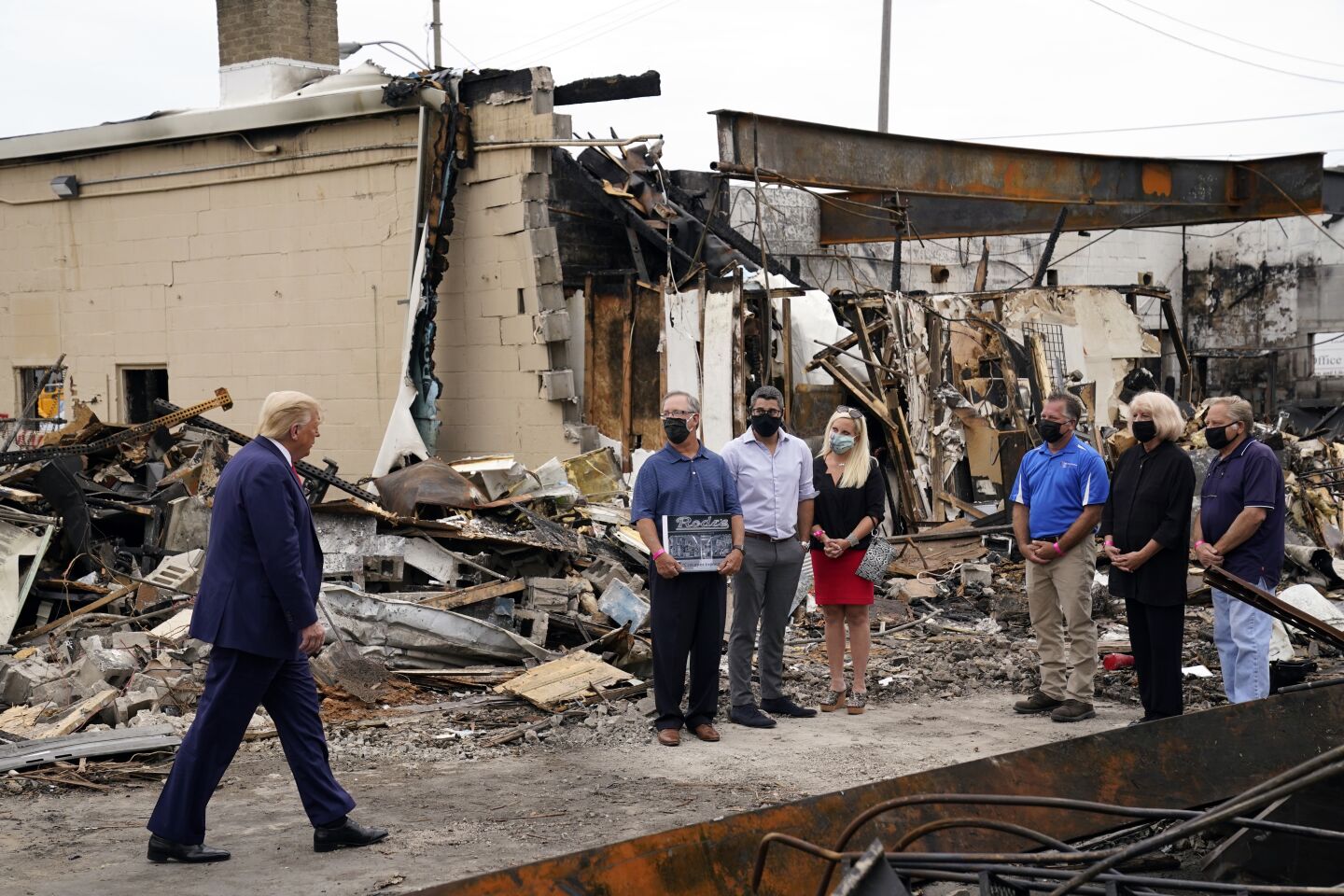President Trump walks up to speak to business owners in Kenosha, Wis.