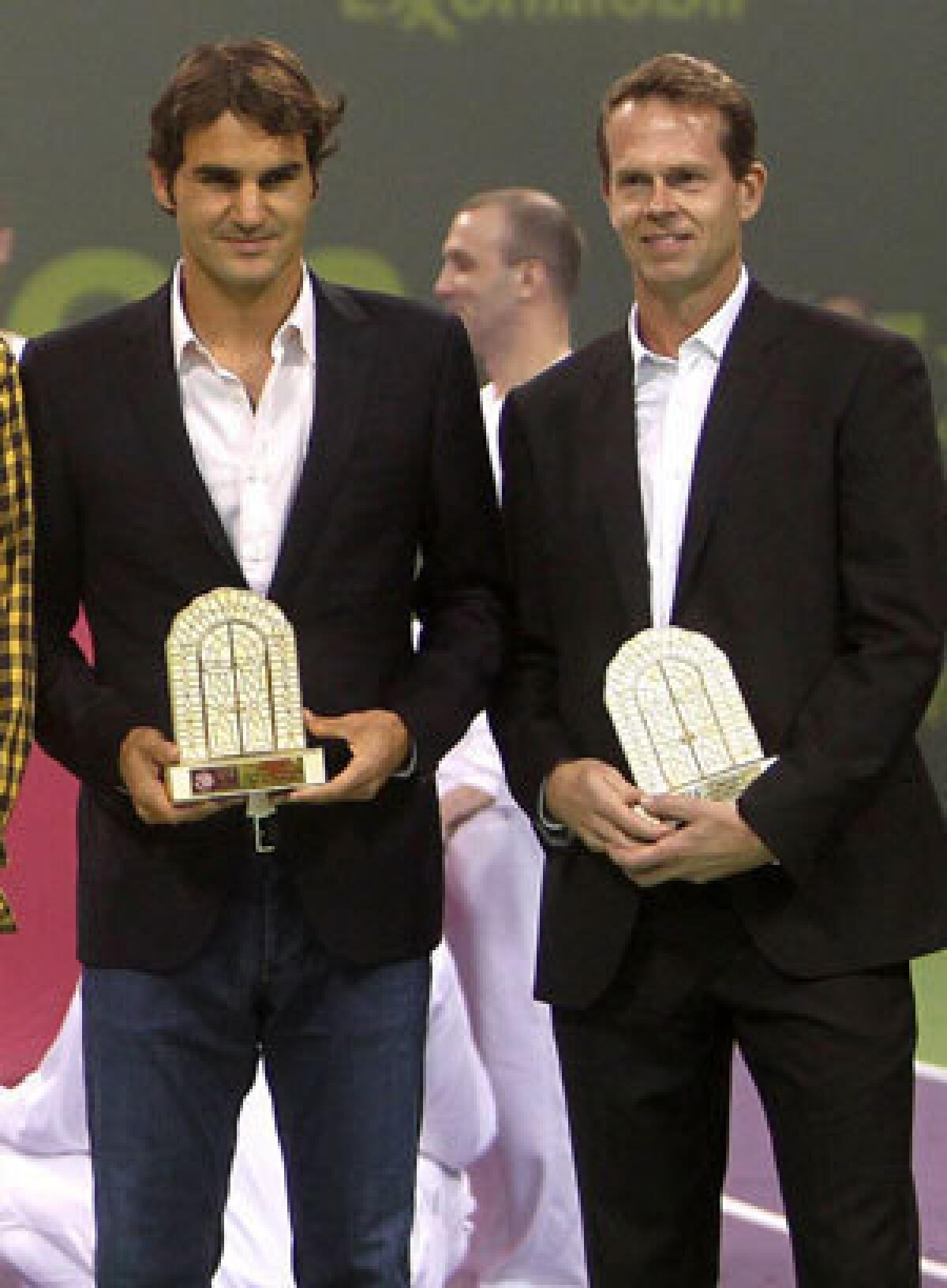 Roger Federer, left, and Stefan Edberg