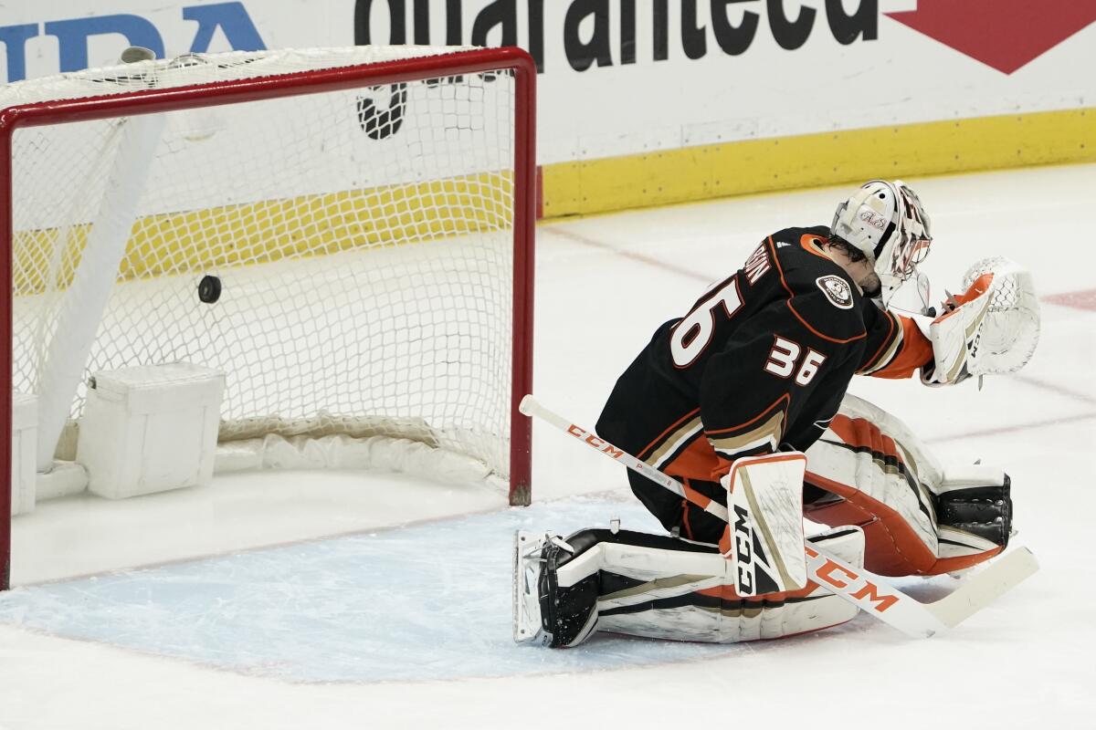 The puck gets past Ducks goaltender John Gibson for a first-period goal by the Blues' Jordan Kyrou on Jan. 30, 2021.