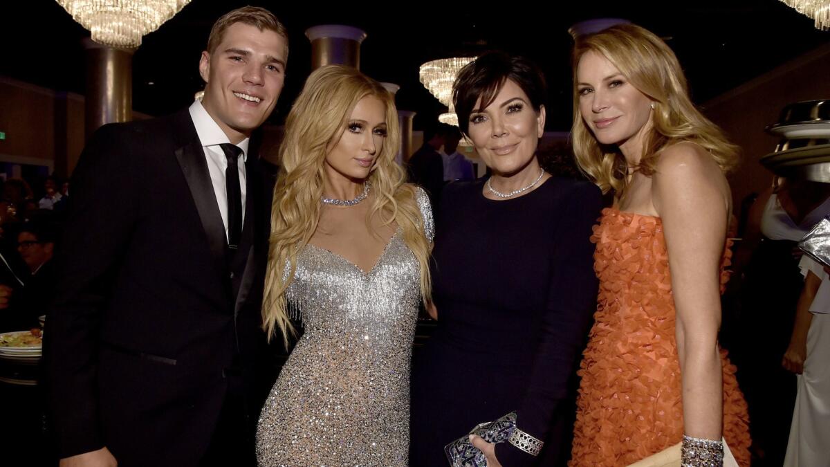 From left, Chris Zylka, Paris Hilton, Kris Jenner and Dee Ocleppo Hilfiger attend the 24th Race to Erase MS gala at the Beverly Hilton in Beverly Hills on May 5.