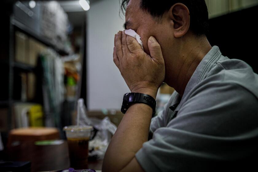 HONG KONG, HONG KONG SAR -- SUNDAY, SEPTEMBER 1, 2019: Ng Chi Fai, a cook who witness the police encounter with protesters at the MTR station that was captured on video and widely circulated on social media last Saturday, weeps as he recounts the details from the event, in Hong Kong, on Sept. 1, 2019. (Marcus Yam / Los Angeles Times)