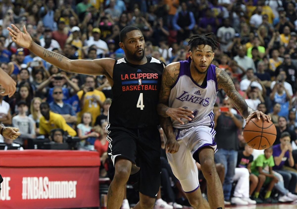 Brandon Ingram of the Los Angeles Lakers drives against Sindarius Thornwell of the Los Angeles Clippers during the 2017 Summer League on July 7, 2017 in Las Vegas.