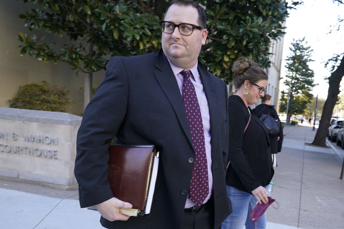 Former Los Angeles Angels employee Eric Kay walks out of federal court where he is on trial.