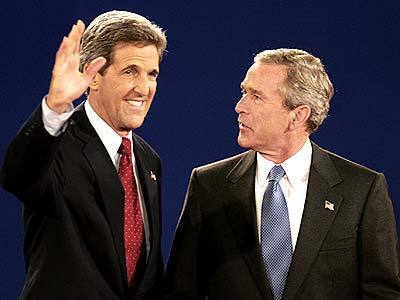 Democratic presidential candidate John Kerry waves as President Bush looks on at the start of the presidential debate in St. Louis.