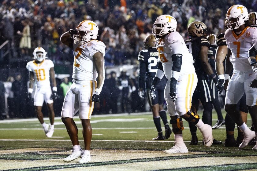 Tennessee running back Jabari Small (2) reacts after scoring a touchdown during the first half of the team's NCAA college football game against Vanderbilt, Saturday, Nov. 26, 2022, in Nashville, Tenn. (AP Photo/Wade Payne)