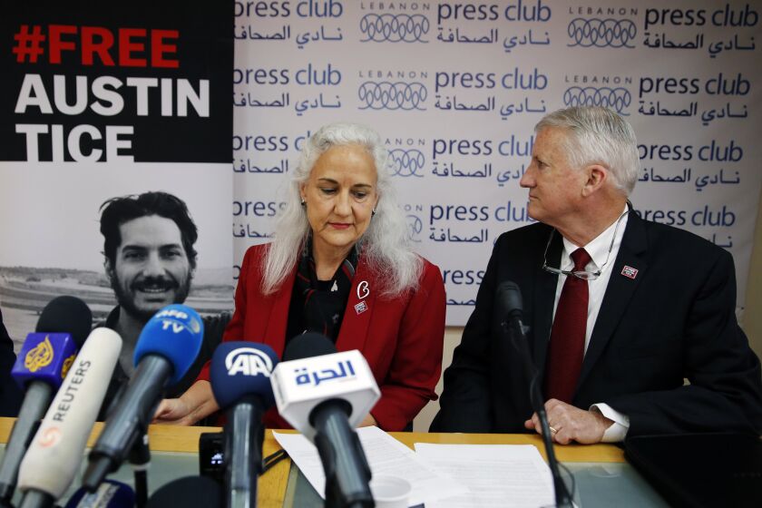 FILE - In this Dec. 4, 2018, file photo Marc and Debra Tice, the parents of Austin Tice, who is missing in Syria, speak during a press conference, at the Press Club, in Beirut, Lebanon. Talks between U.S. and Syrian officials last summer over the fate of Austin Tice and other American hostages foundered over conditions laid out by Damascus and because of a lack of meaningful information provided on the fate of Tice. That's according to people who spoke to The Associated Press in recent weeks about the secretive talks last August. (AP Photo/Bilal Hussein, File)