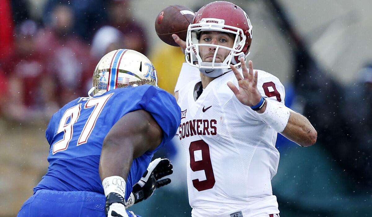 Oklahoma quarterback Trevor Knight, attempting a pass over onrushing Tulsa defensive end Brentom Todd last week, will try to keep the Sooners in the thick of the College Football Playoff chase with a victory over Tennessee on Saturday.