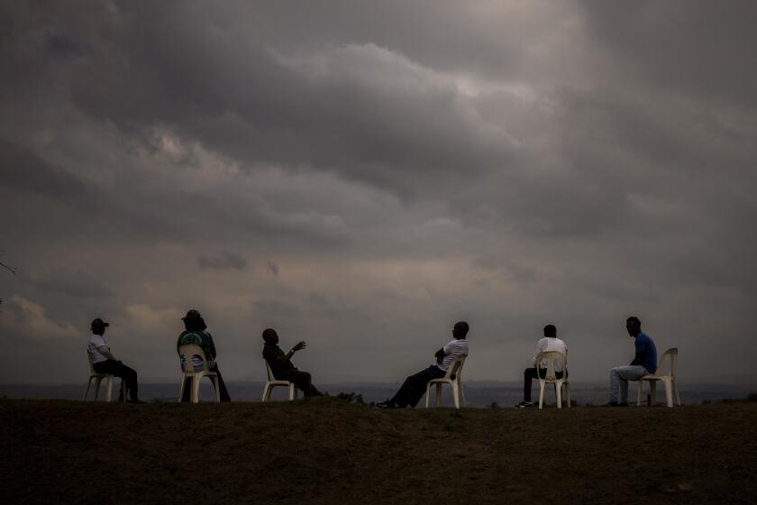 Supporters of Ukhonto weSizwe party sit as they wait for the start of an election meeting in Mpumalanga, near Durban, South Africa, Saturday, May 25, 2024, in anticipation of the 2024 general elections scheduled for May 29. (AP Photo/Emilio Morenatti)