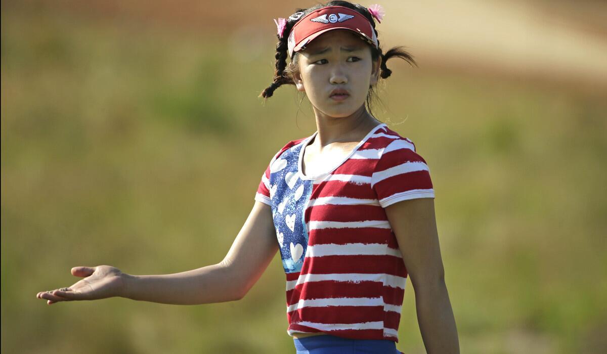 Lucy Li reacts to a shot at the 11th hole during the first round of the U.S. Women's Open on Thursday.