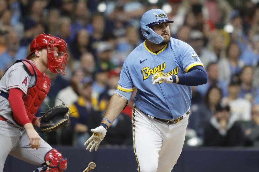 The Brewers' Rowdy Tellez hits a go-ahead, RBI single against the Angels during the eighth inning April 28, 2023.