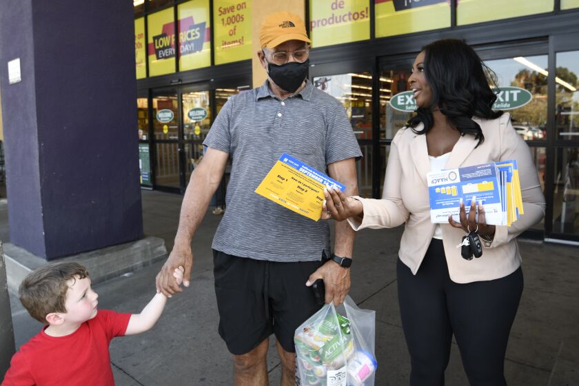 Aeiramique Glass Blake, NAACP San Diego, hands out election literature near Jacobs Center September 9, 2021 in San Diego. (Photo by Denis Poroy)