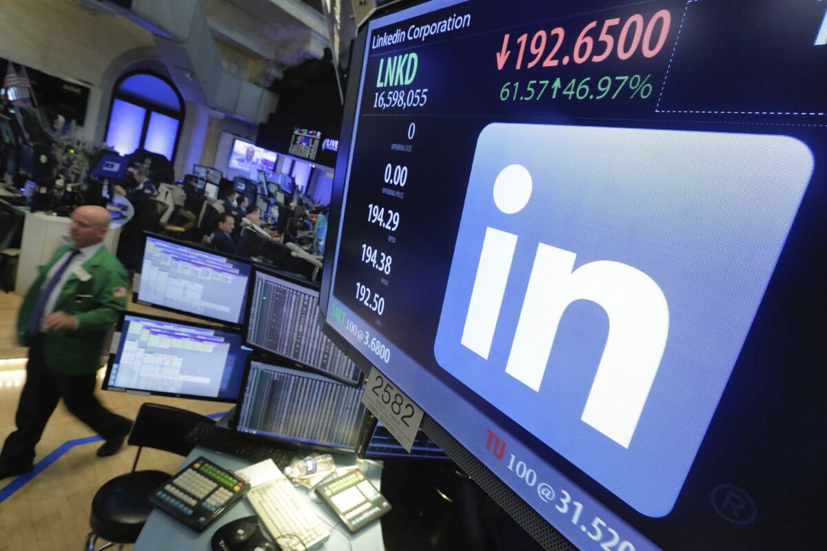 The LinkedIn logo and its stock price on a computer screen.