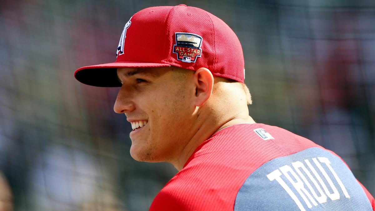 Angels center fielder Mike Trout smiles during batting practice Tuesday before the MLB All-Star Game in Minneapolis.