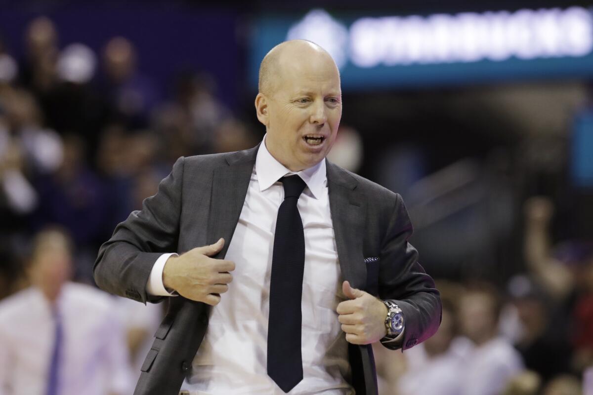 UCLA coach Mick Cronin walks along the bench during a game against Washington on Jan. 2.