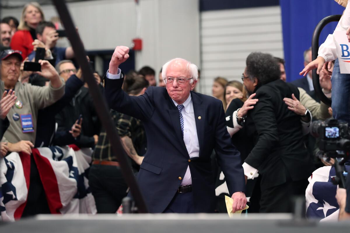 Sen. Bernie Sanders takes the stage during a primary night party in Manchester, N.H.